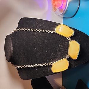 Gold toned necklace with beautiful butterscotch colored statement pieces.